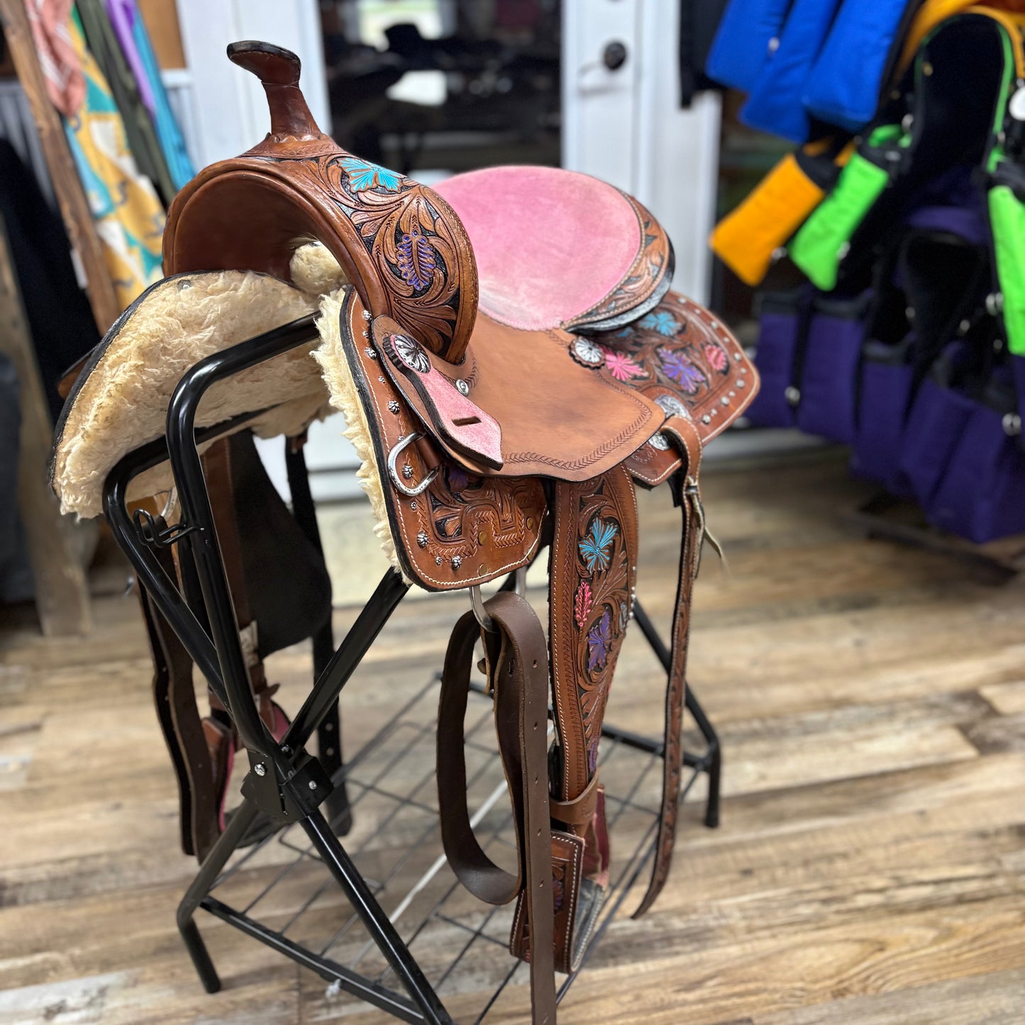 Used 14.5 inch Youth Barrel Saddle Pink Seat, Purple, and Blue Floral Tooling