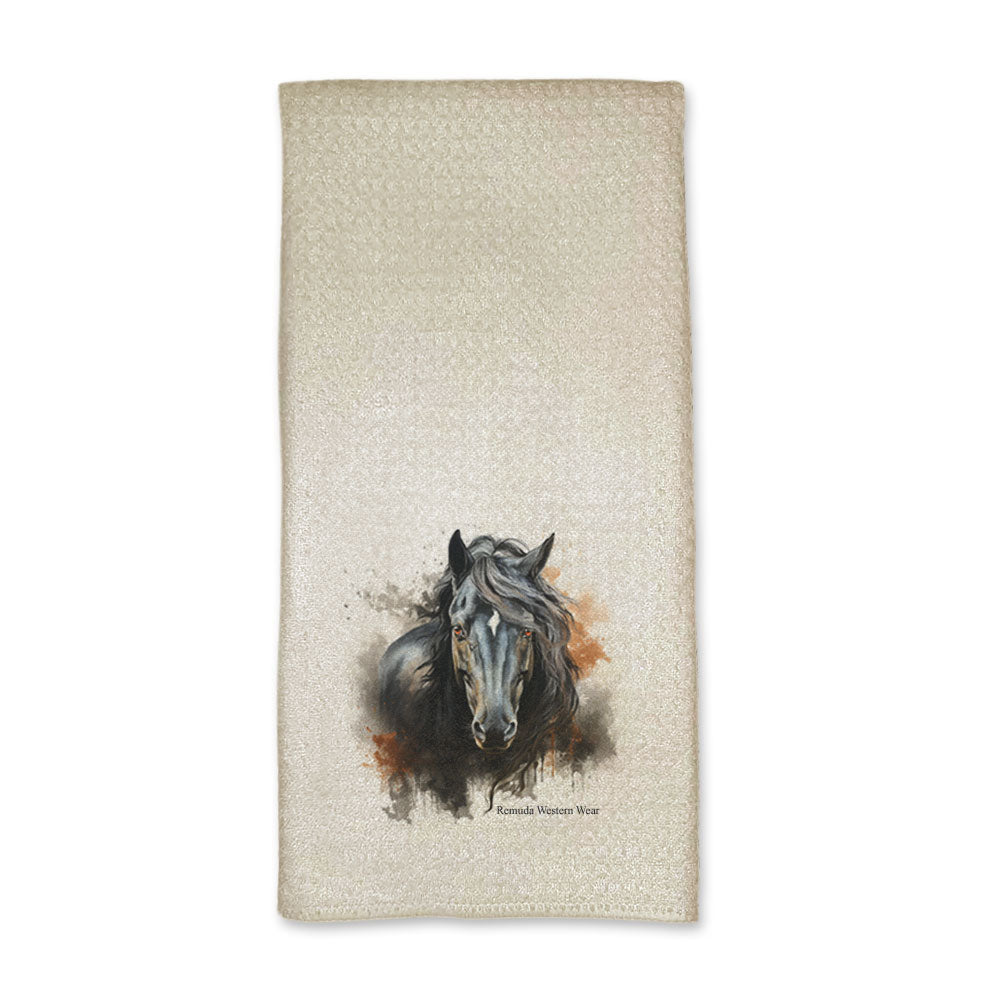 A vibrant western ranch style kitchen hand towel featuring a a stunning black stallion with vibrant orange and dark gray grunge style designs around him. Comes in a cream color. The design captures the spirit of western culture.